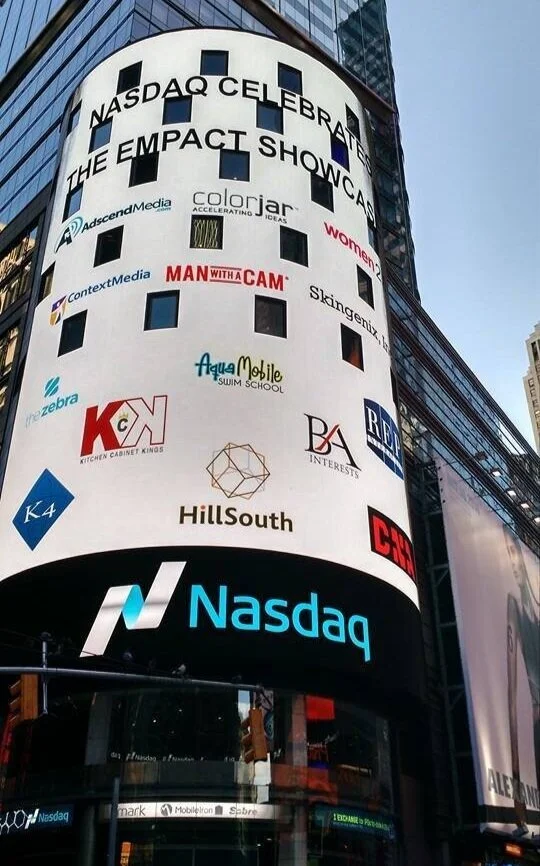Adscend Media shown on the Nasdaq tower at the Empact Showcase